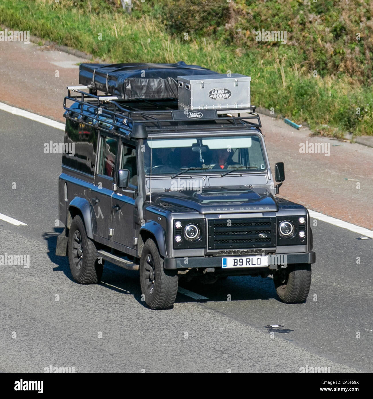 2007 grey Land Rover Defender 110 Station wagon, with snorkel exhaust. Vintage  expedition leisure, British off-road 4x4, rugged off-road all-terrain overland rally adventure vehicle, LandRover Discovery Turbo Diesel UK travelling on the M6 near Lancaster, UK Stock Photo