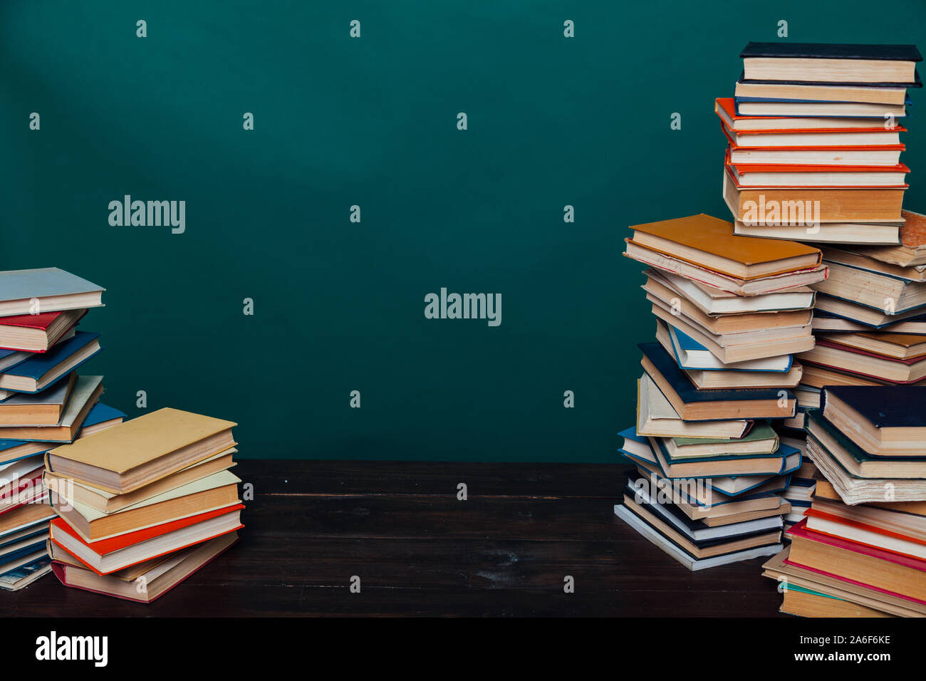 school a lot of different educational books on a green background Stock Photo