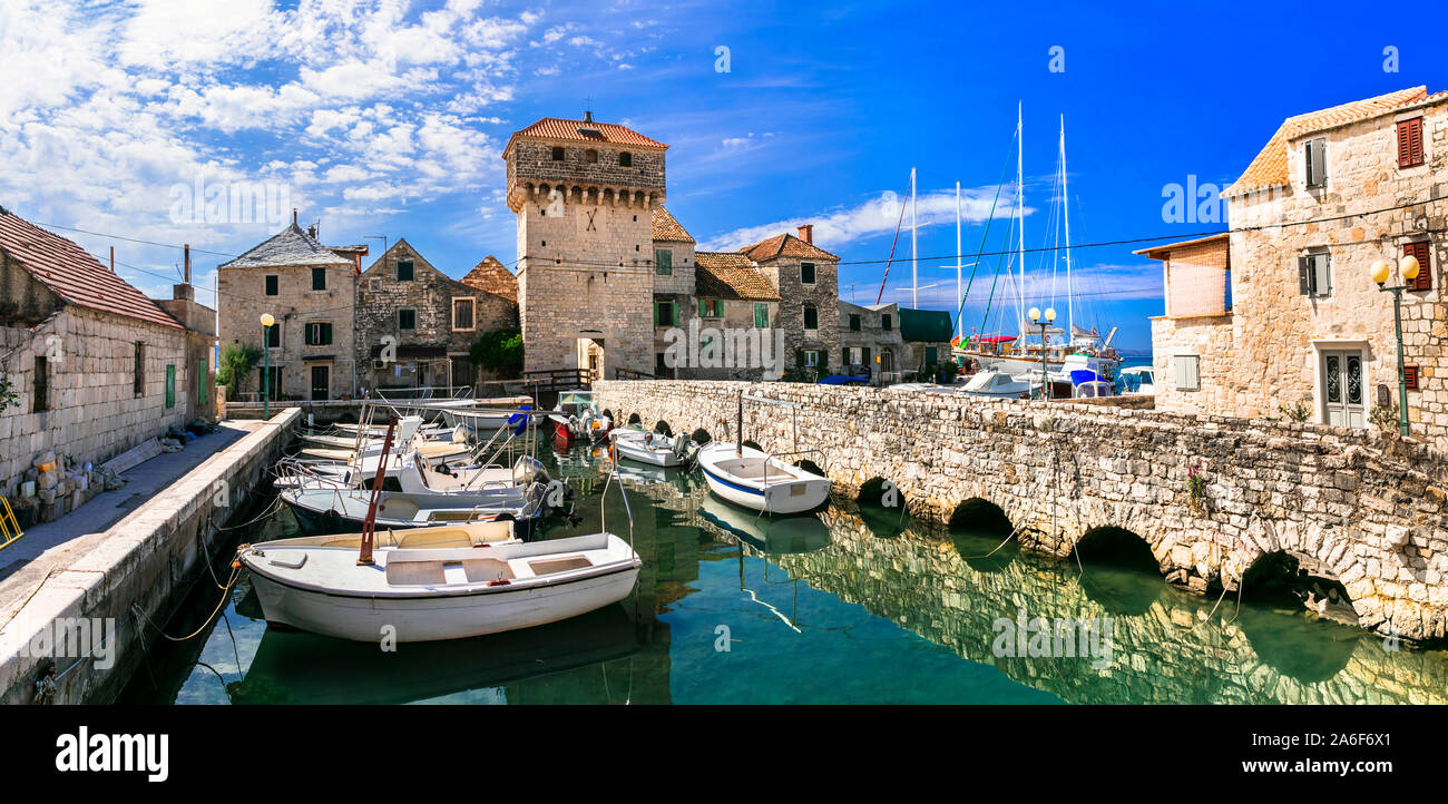 Beautiful scenery of Dalmatia. Croatia. Old castle and traditional fishing village Kastel Gomilica in Kastela town Stock Photo