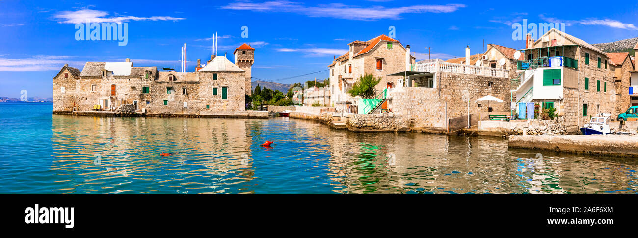 Beautiful scenery of Dalmatia. Croatia. Old castle and traditional fishing village Kastel Gomilica in Kastela town Stock Photo