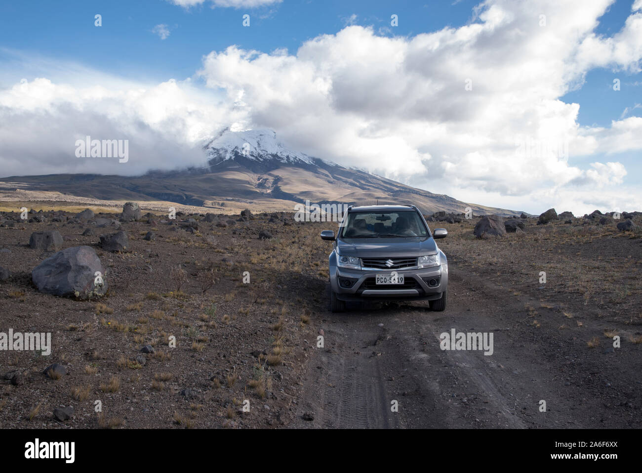 rent car on a gravel road in front ob Cotopaxi volcano in Ecuador Stock Photo Alamy