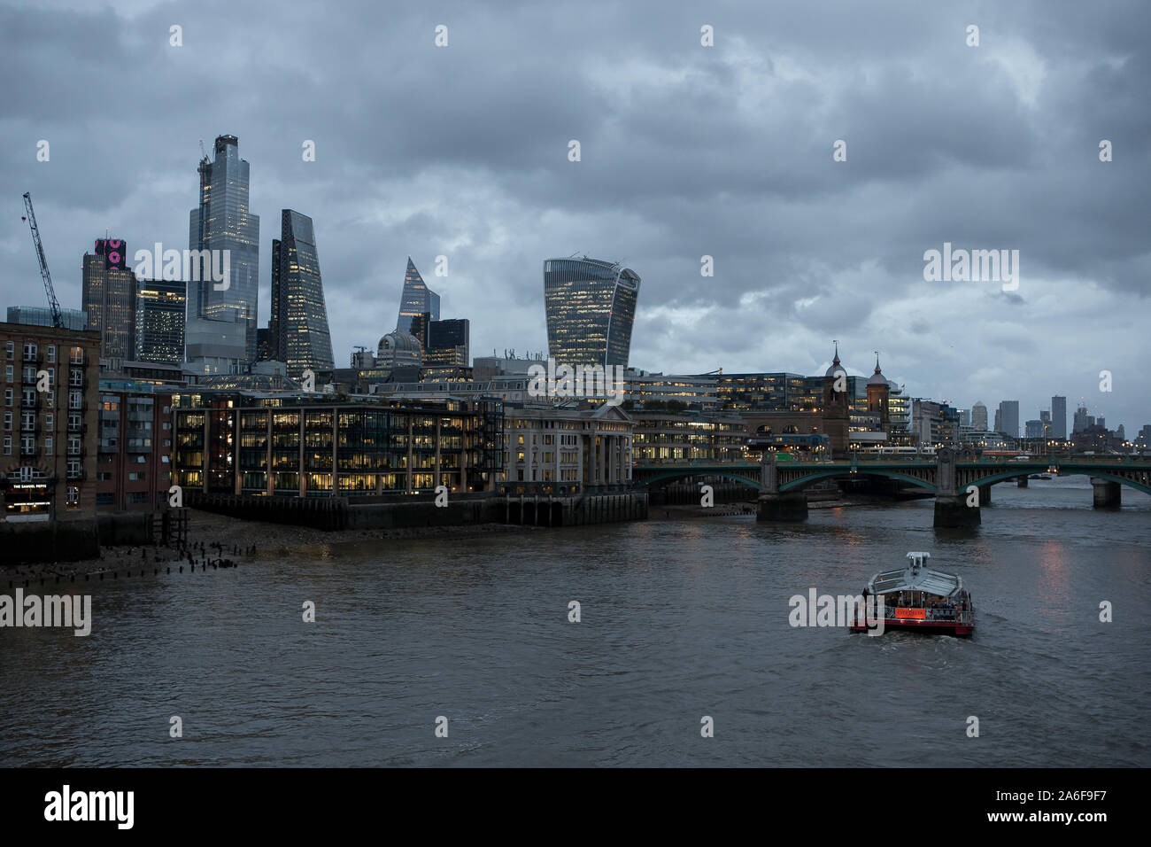 City of London General View GV from the Millennium Bridge in the early evening during autumn. Stock Photo