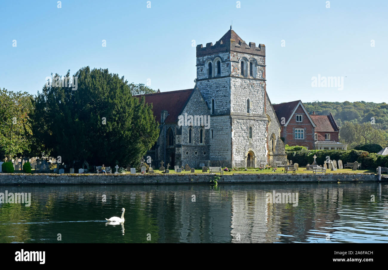 Berks - riverside church at Bisham - Thames - summertime - solitary white swan - contrasts - reflections - tranquil Stock Photo