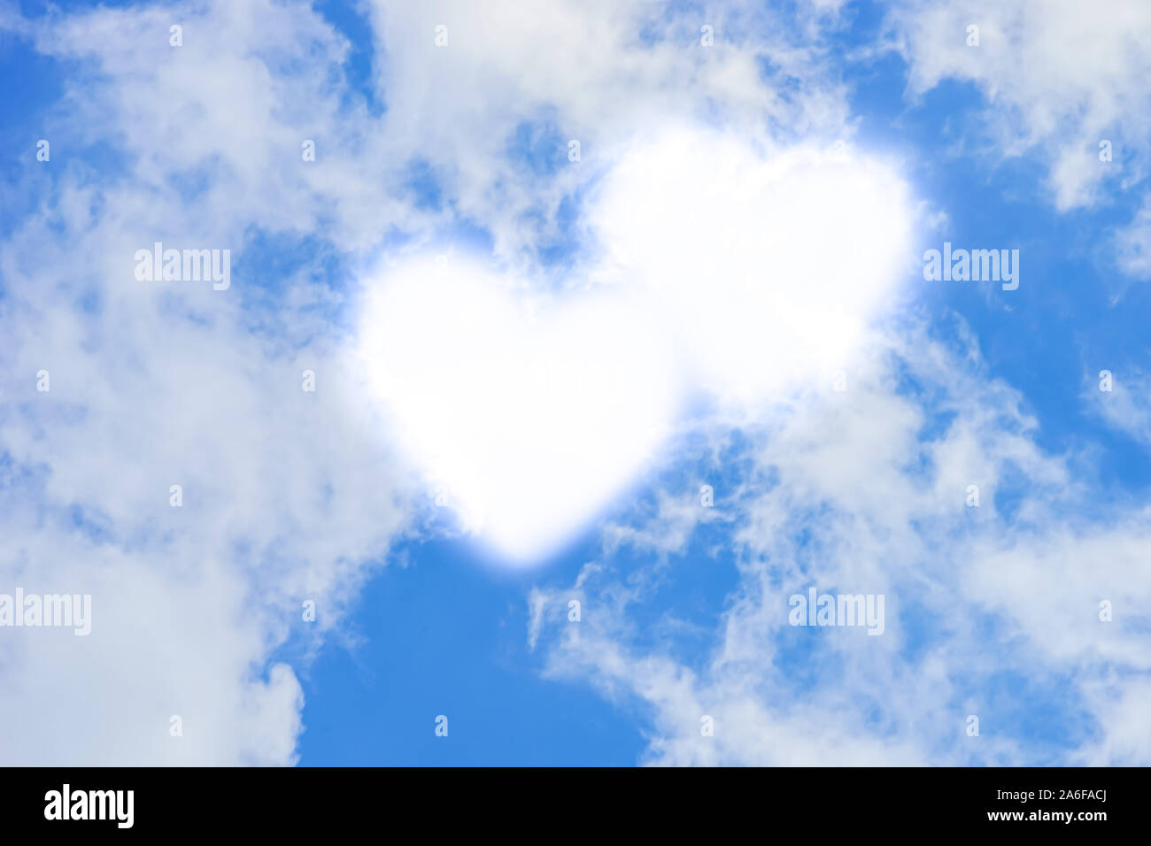 Blue sky with white clouds in hearts shape. Stock Photo
