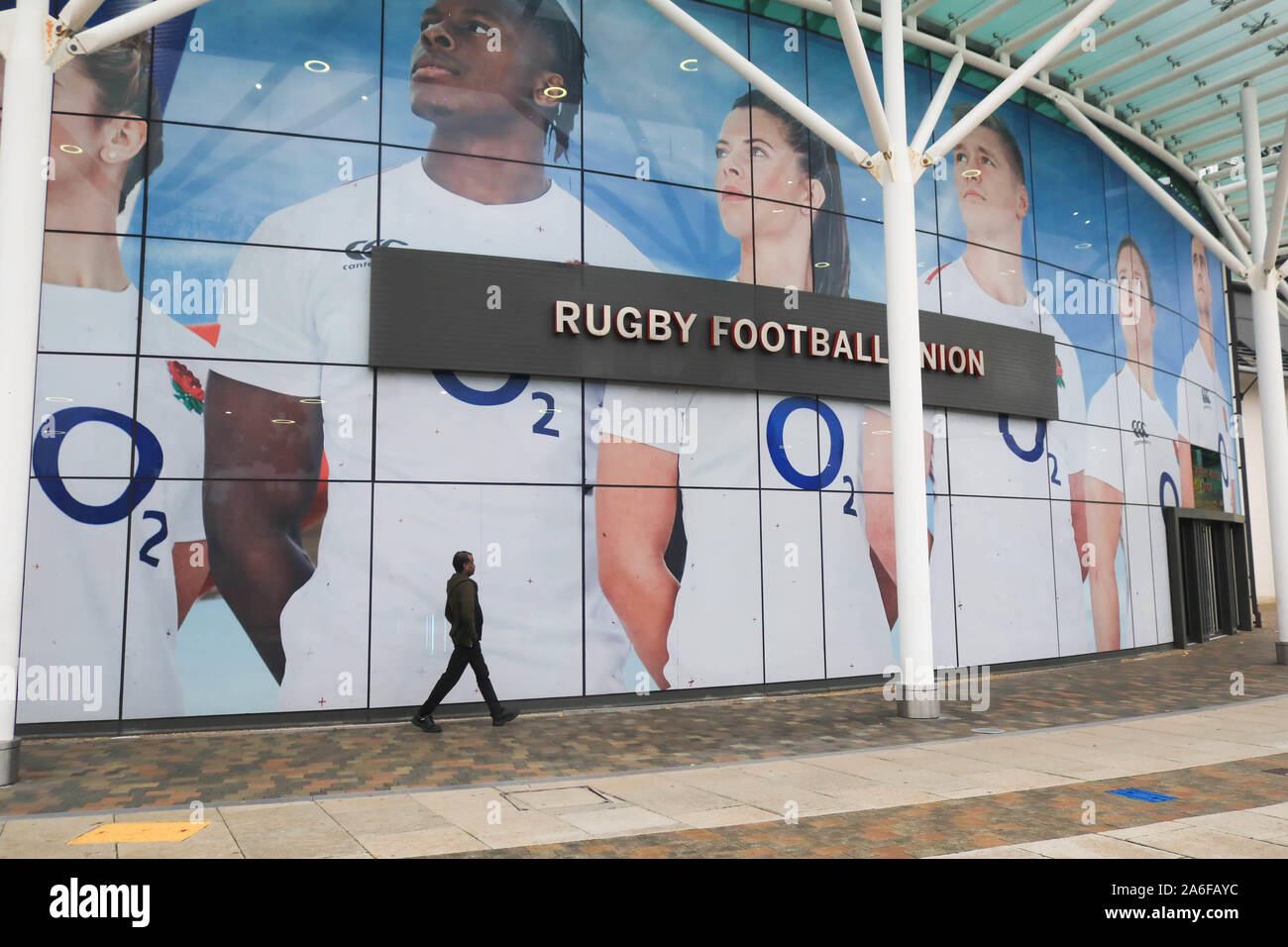 England Rugby Sign Twickenham London UK. 26 October 2019 .A pedestrian walks past a large ...