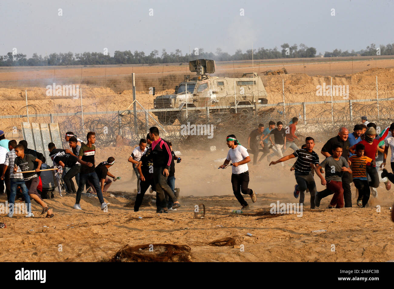 Palestinians take part in a demonstration, on the Gaza-Israel border, in east of Rafah in the southern Gaza Strip, on Oct 25, 2019. Stock Photo
