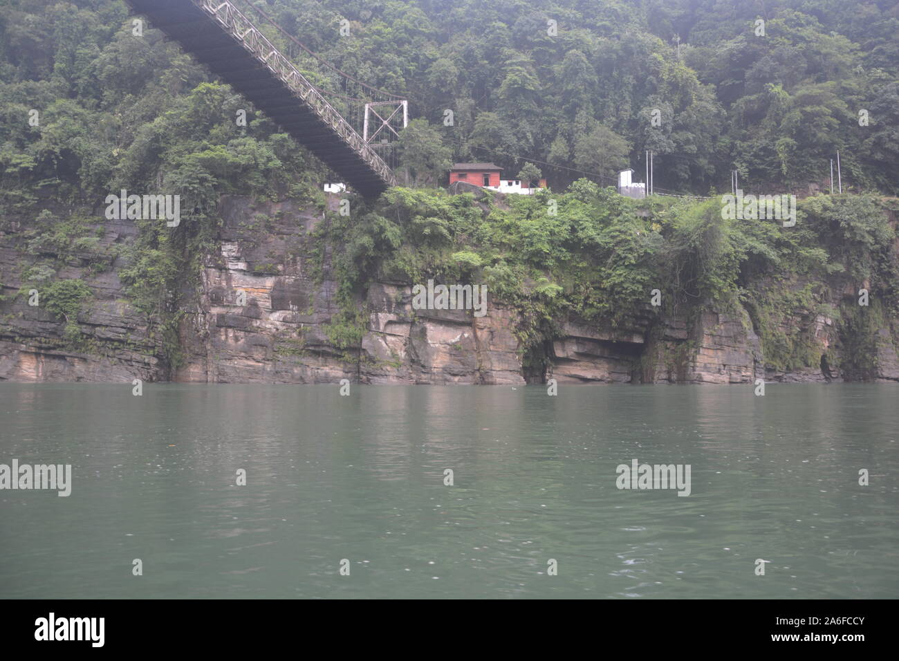 The hanging suspension  bridge of  Umngot river in Dawki, Shillong, Meghalay near India-Bangladesh border as seen from below the river Stock Photo