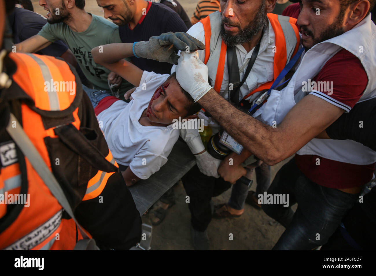 Palestinians take part in a demonstration, on the Gaza-Israel border, in east of Rafah in the southern Gaza Strip, on Oct 25, 2019. Stock Photo