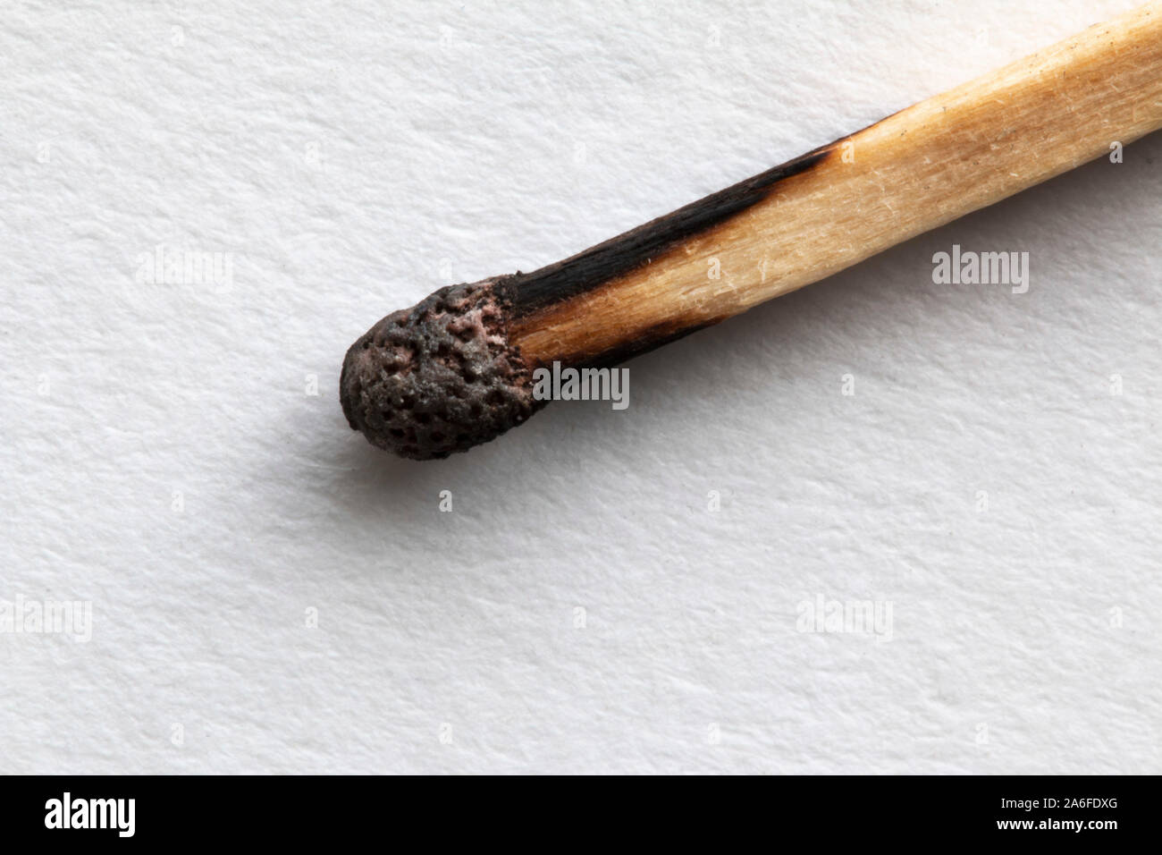 A used match on a white background Stock Photo