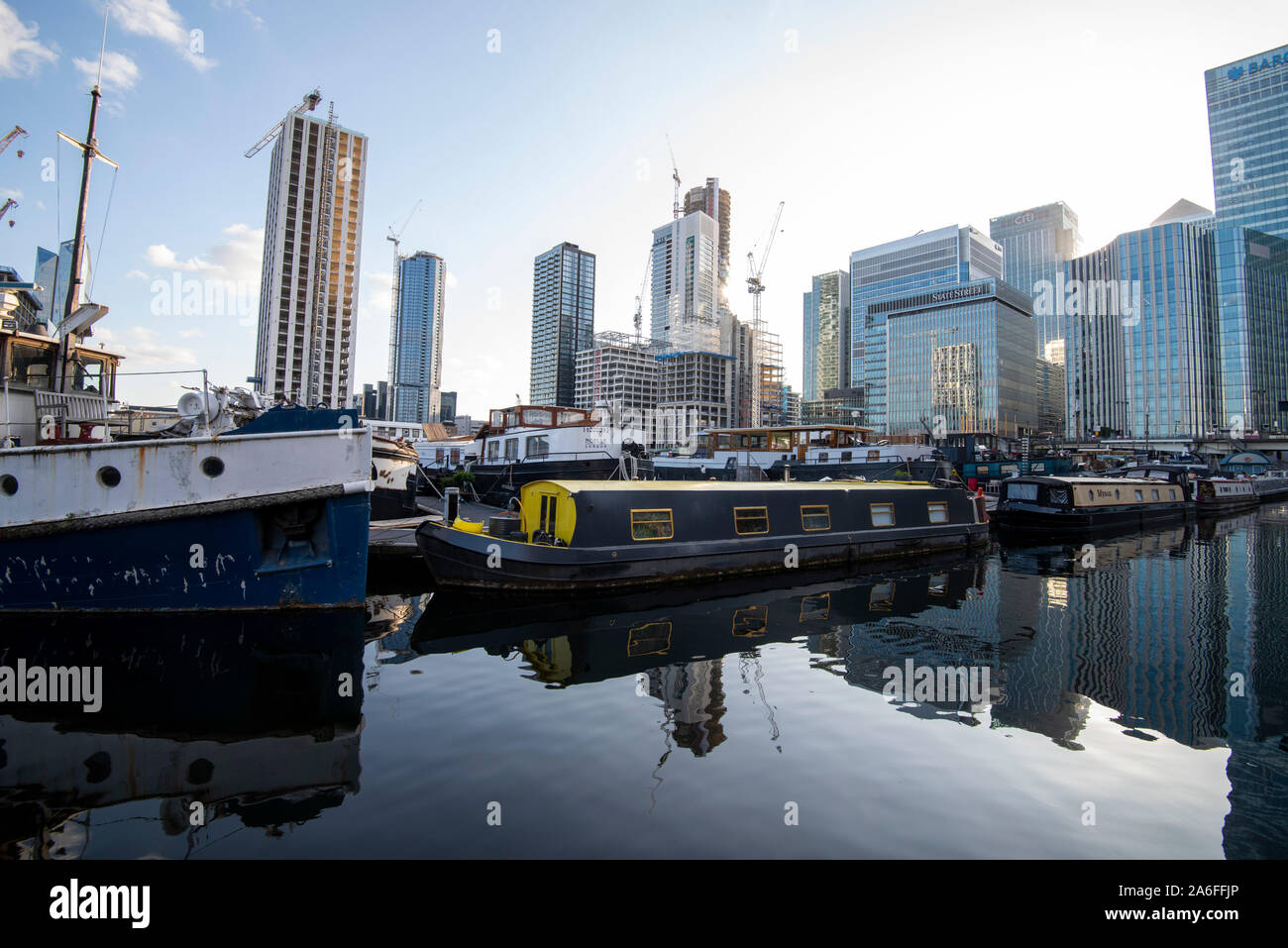 Reflections in the Blackwall Basin looking towards Canary Wharf in London, England UK Stock Photo