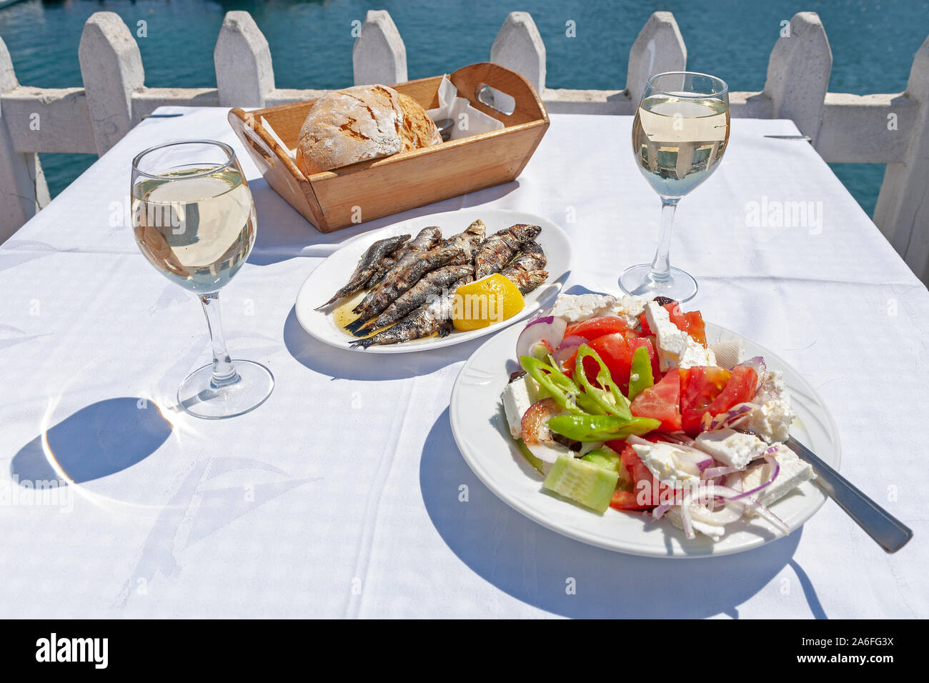 Greek food served in a pavement restaurant in Chalcidice, Greece. Stock Photo