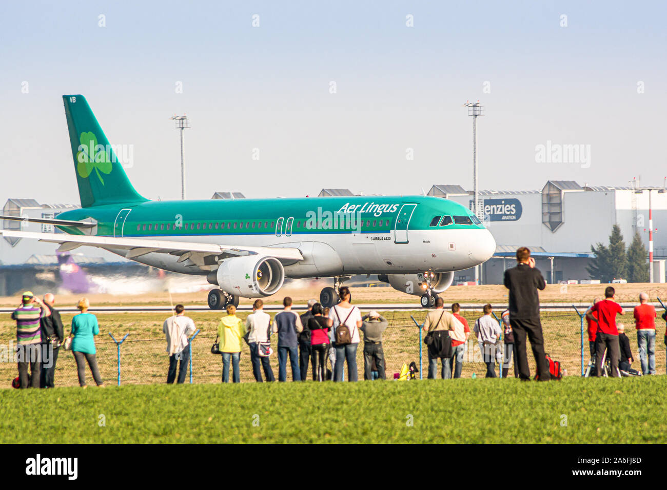 Prague, Czech Republic - March 14, 2014. People watching airplanes Landing and taking off at the airport Stock Photo