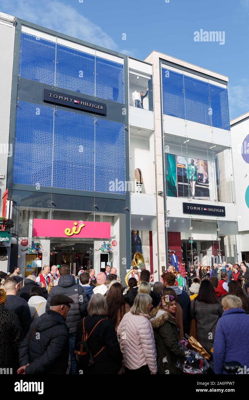 Cork, Ireland, 26th October 2019. 42nd Guinness Cork Jazz Festival, Cork  City. Members of staff watchign the band below from Tommy Hilfiger. Today  is the second day of the 42nd Gunniess Cork