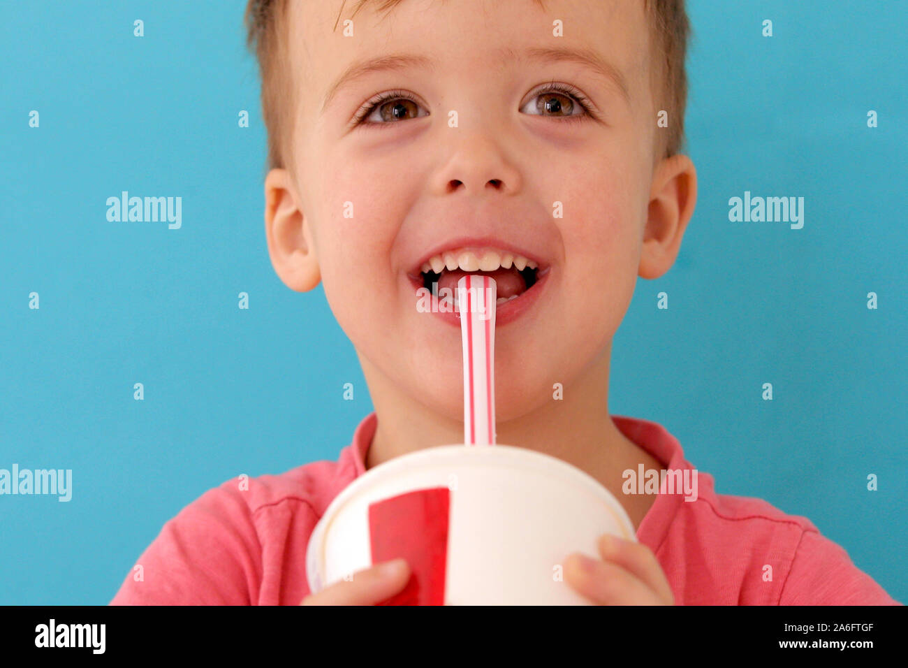 Baby boy drinking milkshake Stock Photo Alamy