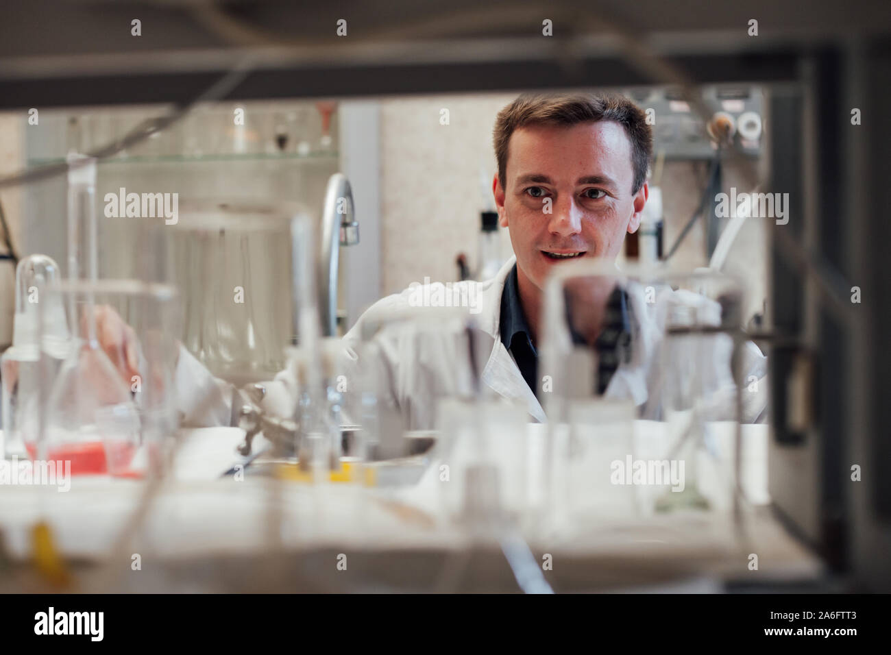 male scientist conducts chemical experiments with liquids in science