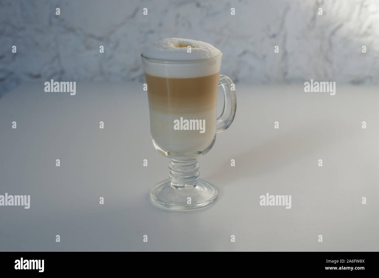 Coffee Latte Macchiato. Cup of latte in a cafe. Coffee in a glass cup