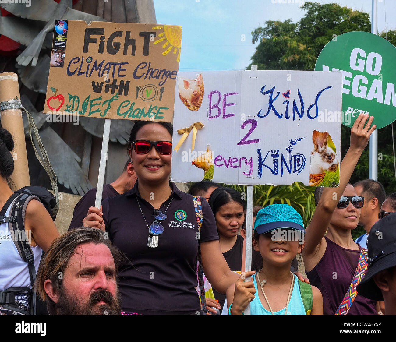 Manila, Philippines. 26th Oct, 2019. A mother and daughter hold placards during the demonstration. The second Animal Rights March in Manila took place today, the purpose of the march is to unite the vegan community globally. The march aims at bringing to light the ways in which animals are being abused, exploited and tortured in the food, pharmaceutical, entertainment, fashion and sport industries. Credit: SOPA Images Limited/Alamy Live News Stock Photo