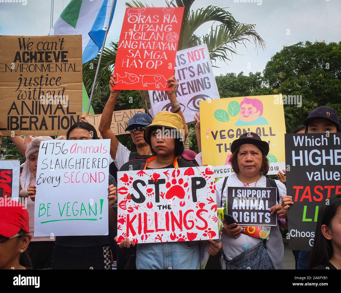 Manila, Philippines. 26th Oct, 2019. Vegans and animal rights advocates hold placards before the demonstration. The second Animal Rights March in Manila took place today, the purpose of the march is to unite the vegan community globally. The march aims at bringing to light the ways in which animals are being abused, exploited and tortured in the food, pharmaceutical, entertainment, fashion and sport industries. Credit: SOPA Images Limited/Alamy Live News Stock Photo