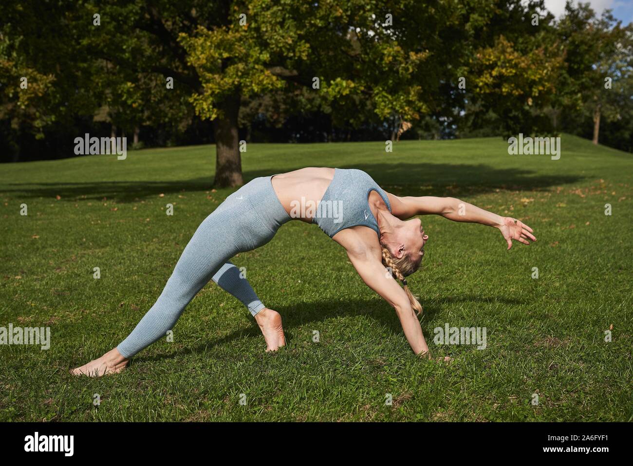 Woman doing yoga activity hi-res stock photography and images - Alamy