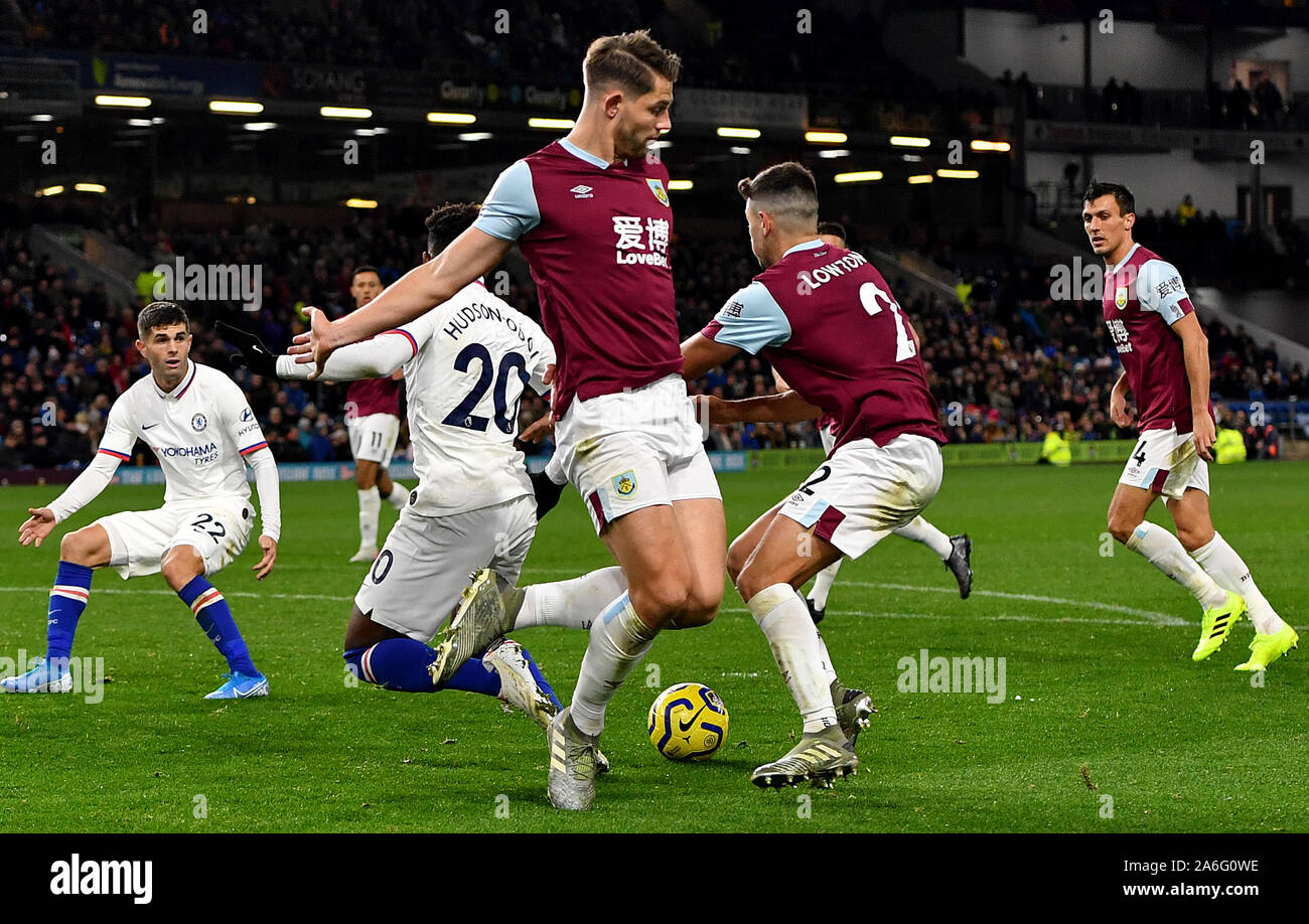 Chelsea's Callum Hudson-Odoi (centre) goes down in the penalty area after an apparent foul by Burnley's James Tarkowski (left) given as a penalty by match referee Michael Oliver, which is then overturned by VAR during the Premier League match at Turf Moor, Burnley. Stock Photo