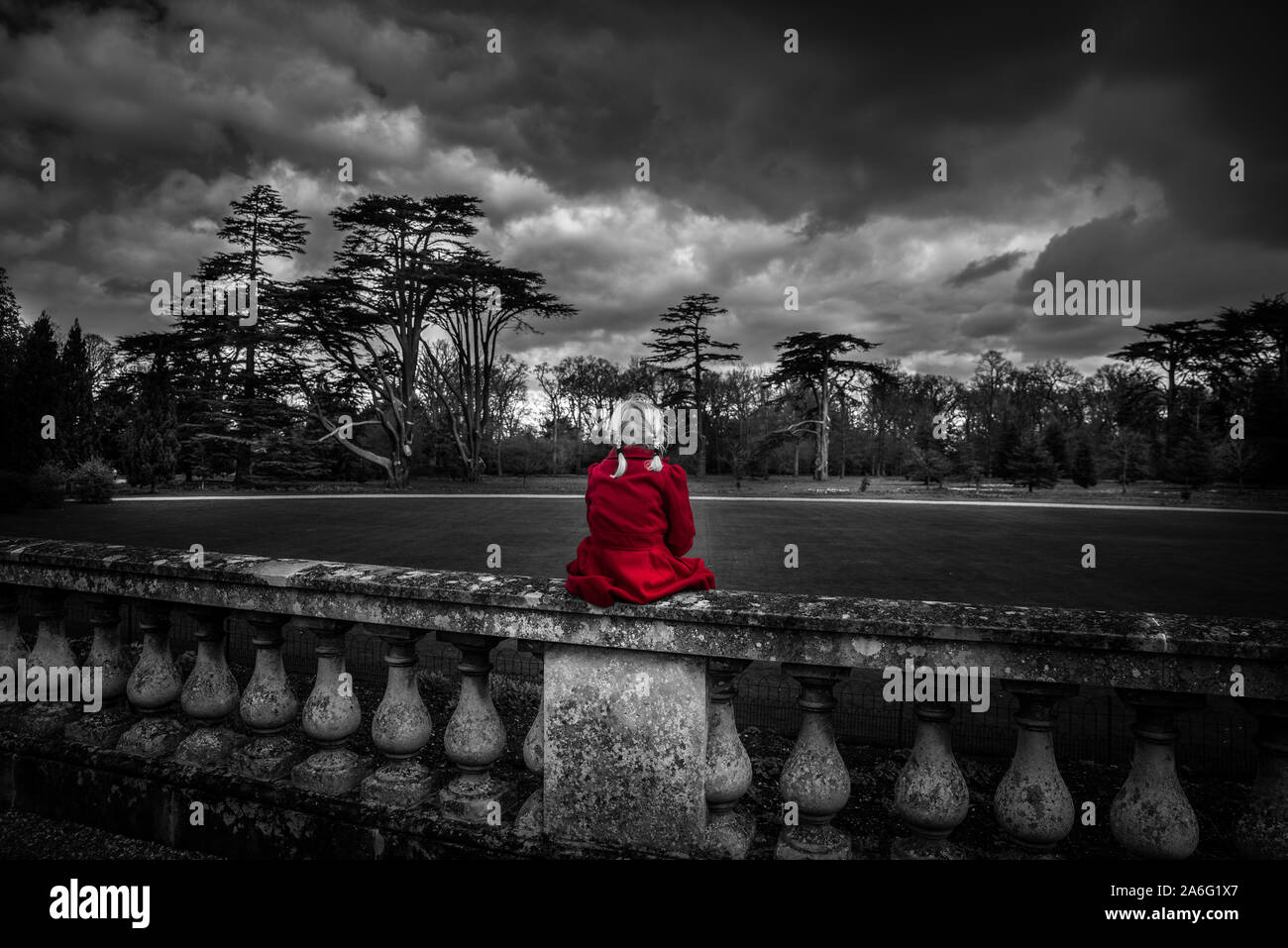 A little girl in a red coat looking at Ickworth house on a family day out,  beautiful architecture and historic buildings, isolated, alone, thoughful  Stock Photo - Alamy