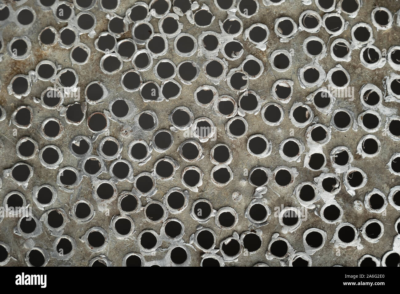 Holes in aluminum. Randomly holes in metal. Texture metal holes. Top