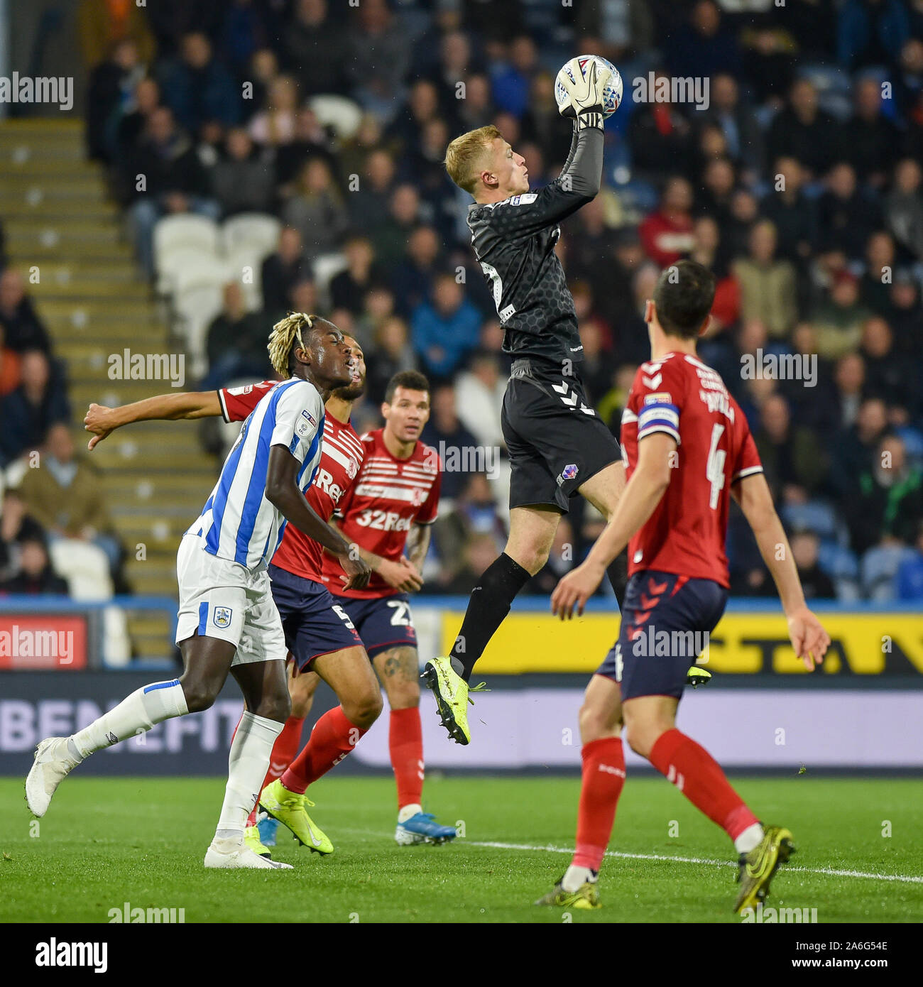 23rd October 2019, John Smith's Stadium, Huddersfield, England; Sky Bet Championship, Huddersfield Town v Middlesbrough : Aynsley Pears (42) of Middlesborough pluses ball out of the air. Credit: Dean Williams/News Images Stock Photo