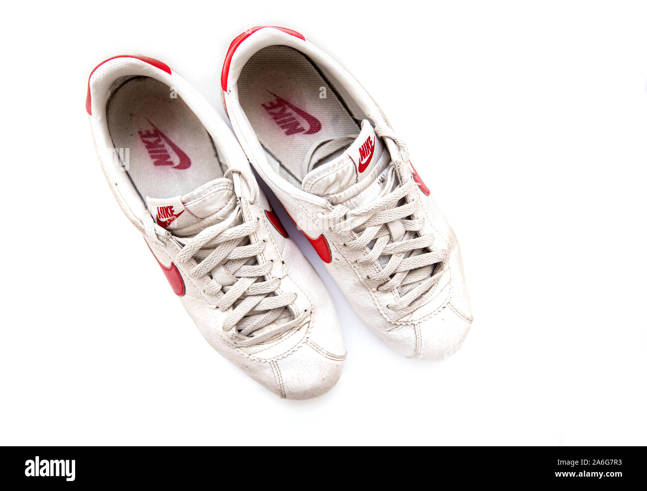 Flåde rulle indstudering NEW YORK - OCT 26: Vintage dirty NIKE Sneakers isolated on white Background  in NY on October 26. 2019 in USA. Nike's Swoosh logo, shaped like a Tick  Stock Photo - Alamy
