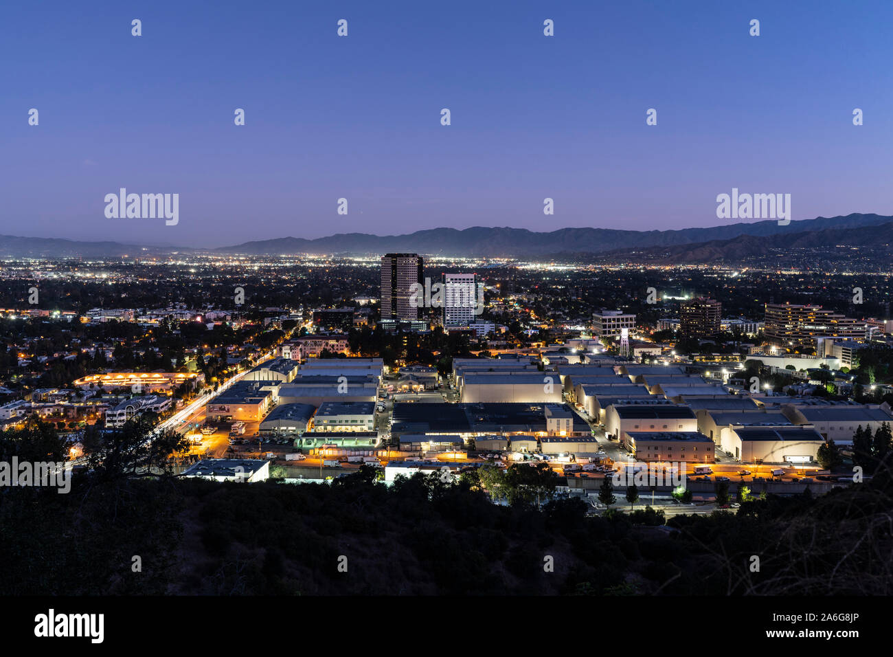 Burbank, California, USA - October 25, 2019:  Twilight predawn morning view of historic Warner Bros studio sound stages and Burbank Media District. Stock Photo