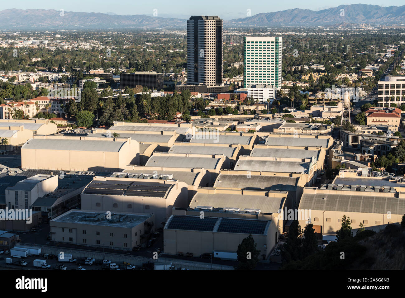 Burbank, California, USA - October 20, 2019:  Morning view of historic Warner Bros studio sound stages and Burbank Media District buildings in the San Stock Photo