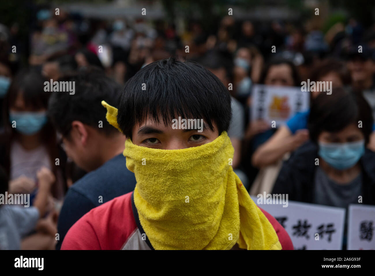 A pro-democracy protester with a yellow towel covering his face during an assembly of medical professionals in Central district in Hong Kong.Anti-government demonstrations in Hong Kong stretched into the fifth month as the controversial extradition bill was officially withdrawn on Wednesday while protesters continue to call for Hong Kong's Chief Executive Carrie Lam to meet their remaining demands, which includes an independent inquiry into police brutality, the retraction of the word 'riot' to describe the rallies, and genuine universal suffrage. Stock Photo