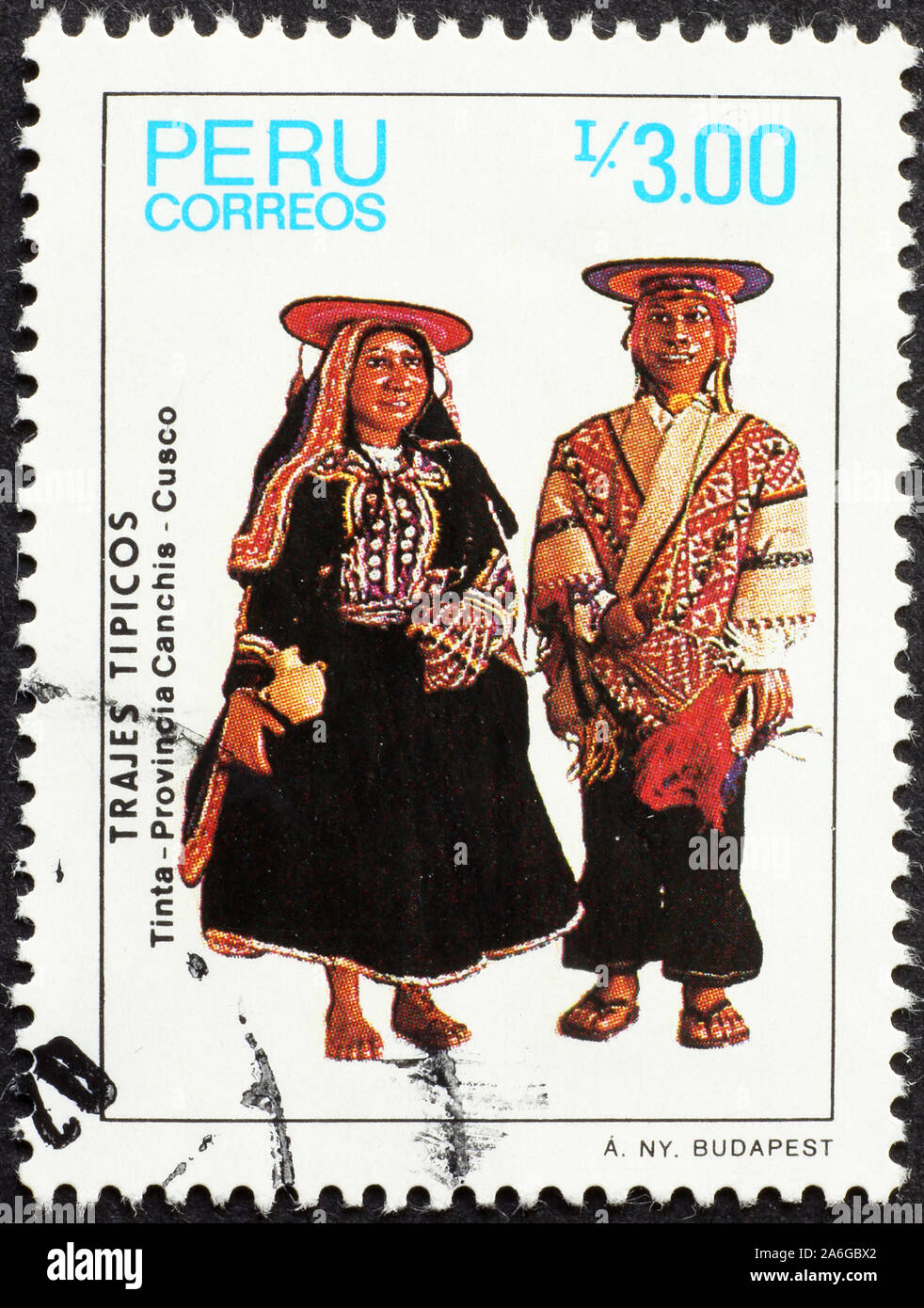 Traditionally dressed couple on peruvian postage stamp Stock Photo