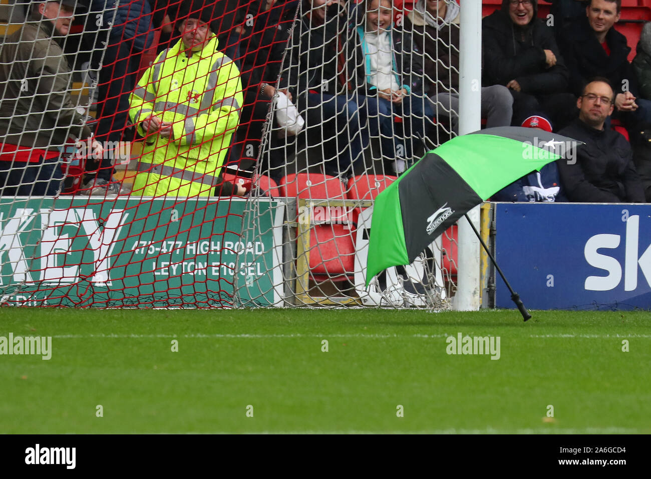London, UK. 26th Oct, 2019. An umbrella blows across the goalmouth during the EFL League Two match between Leyton Orient and Carlisle, at Brisbane Road, London, on 26 October 2019 Credit: Action Foto Sport/Alamy Live News Stock Photo