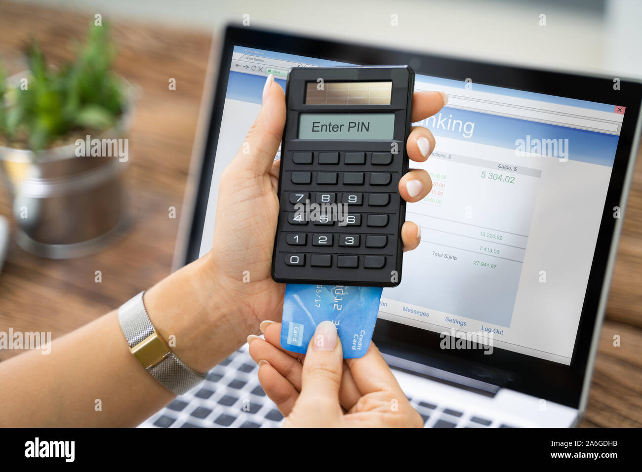 Woman Using Two Factor Authenticating To Do Bank Transfer Stock Photo