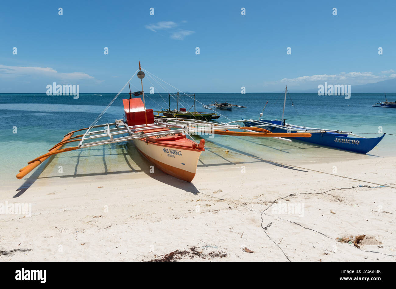 Traditional fishing boats on the beach at Siquijor Island, Philippines. Stock Photo