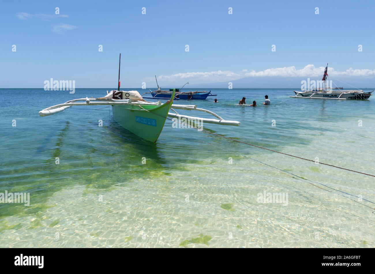 Traditional fishing boats on the beach at Siquijor Island, Philippines. Stock Photo