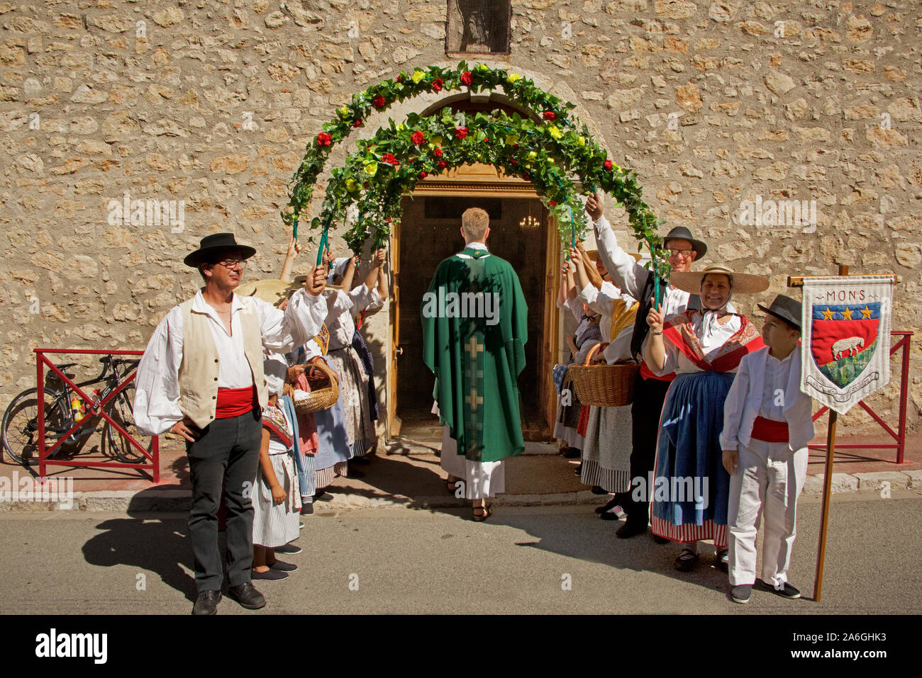 Priest entering church Procession of the Feast of St Joseph Foret St Paul Var  Provence France Stock Photo
