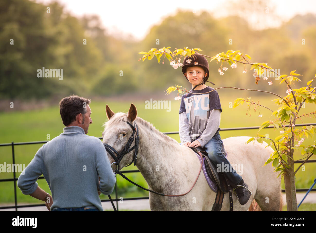 A little boy with Autism, ADHD, Aspergers Syndrome, riding a horse with