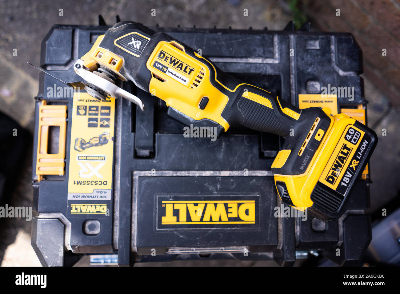 Dewalt 18v XR oscillating mutl-tool brushless motor 4ah lithium ion battery, on a dewalt system T stak case, picture take on the driveway Stock Photo - Alamy