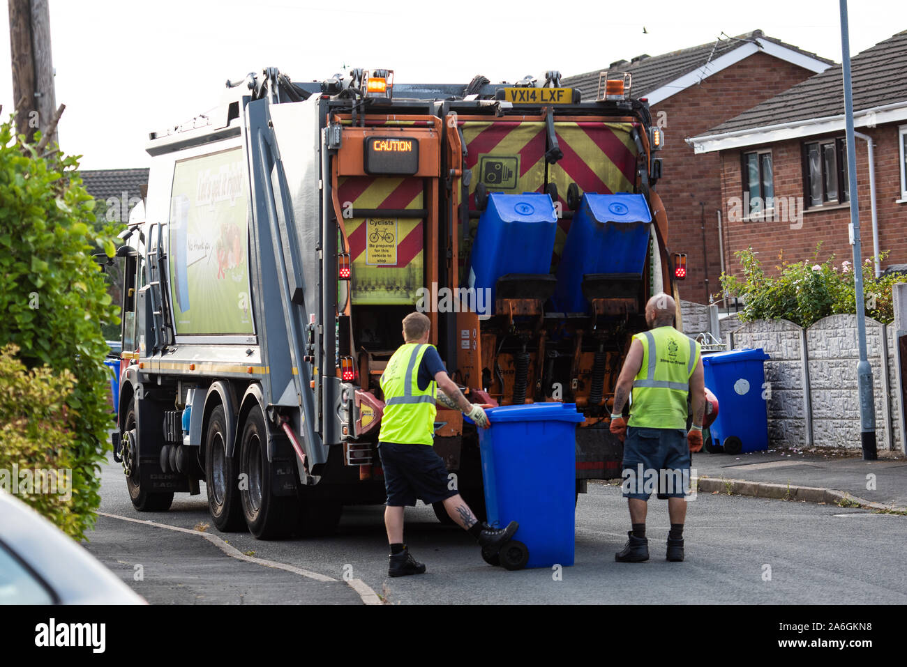 Dustmen putting recycling waste into a waste truck, Bin Men, Recycling