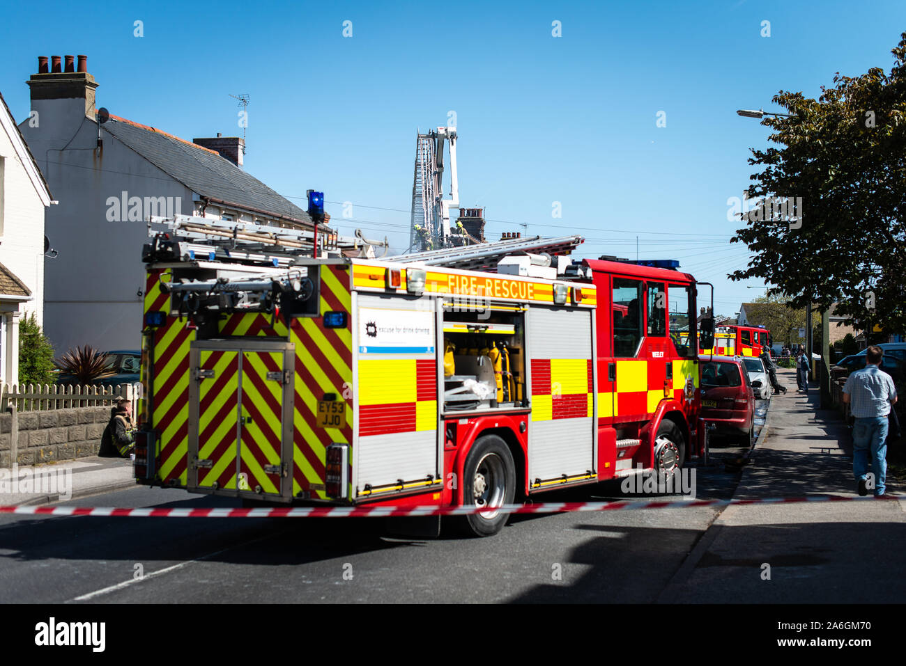 Firefighters attend an emergency scene, with a house on fire in Clacton