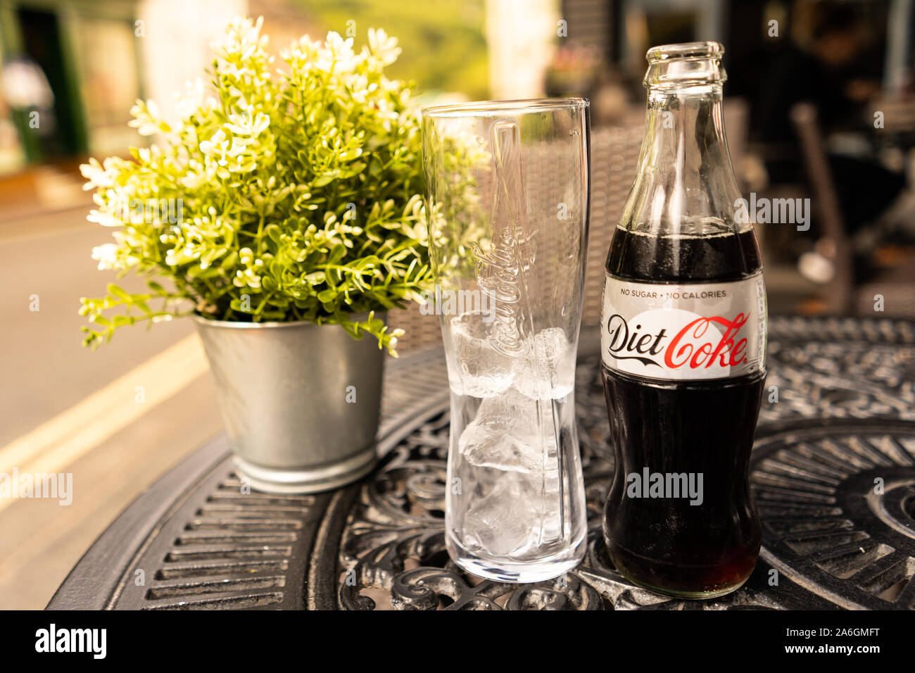 An old fashioned glass bottle of Diet Coke served at a beautiful restaurant  with a glass of ice Stock Photo - Alamy