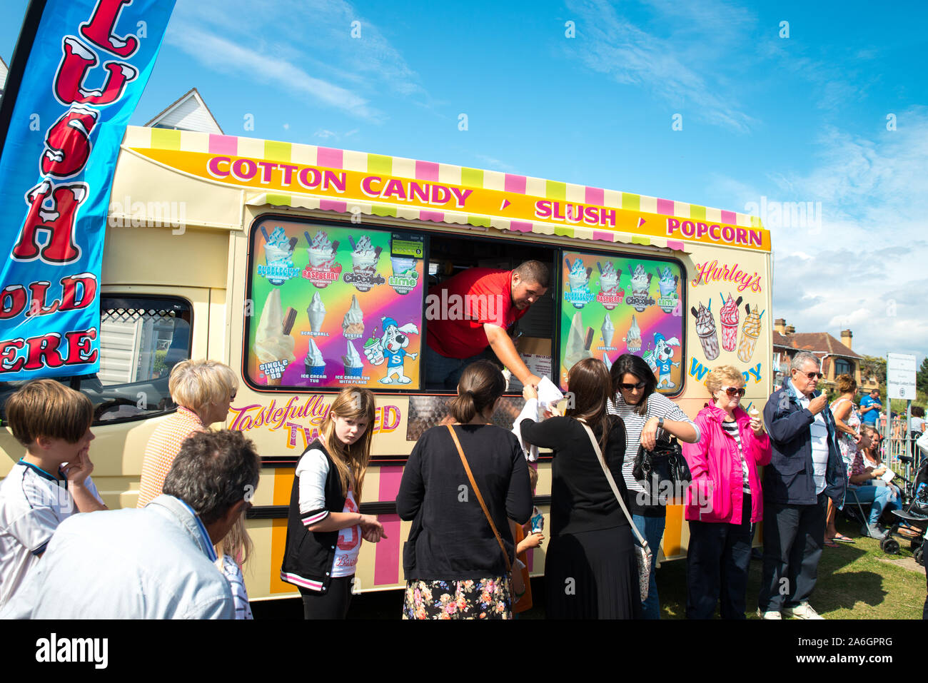 The annual Airshow by the sea, people queueing for ice creams to keep cool in the hot summer weather, Ice cream van Stock Photo