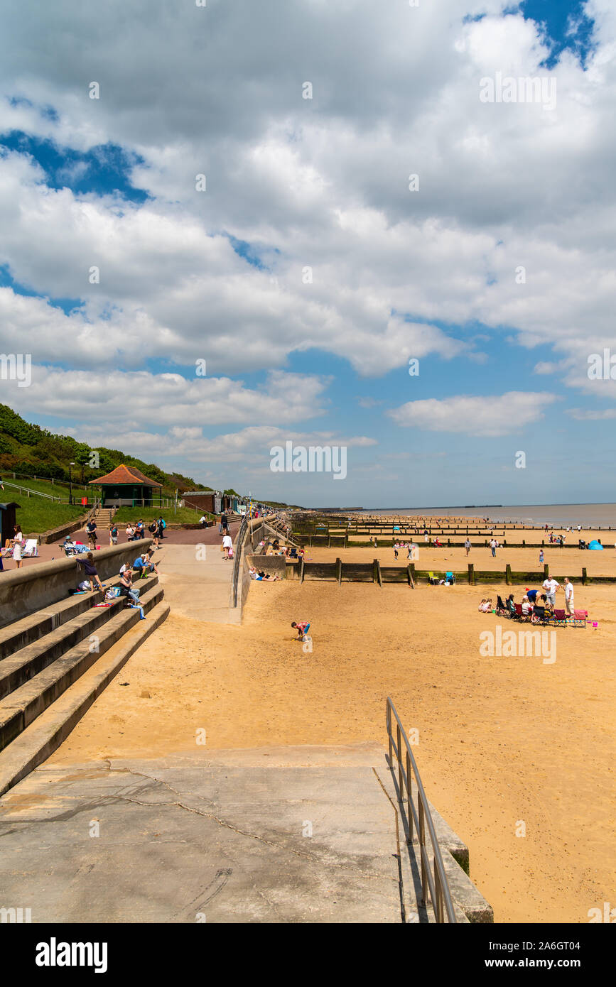 The stunning beach in Frinton on Sea in Essex, by Walton on the Naze on a clear bright blue sunny day in Summer time Stock Photo