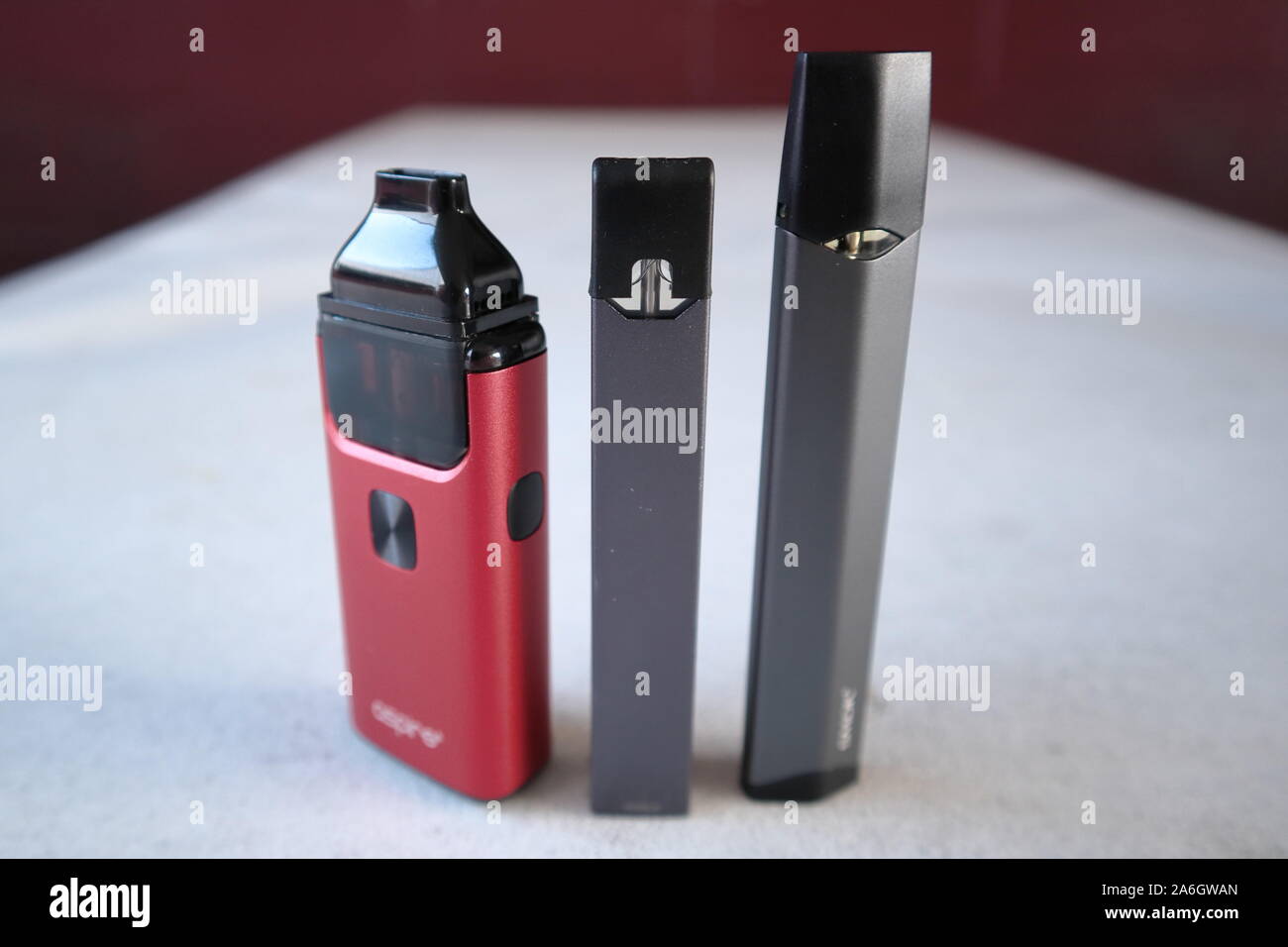 3 different vape pen electronic cigarette devices juul, aspire breeze, smok infinix, product shot isolated Stock Photo