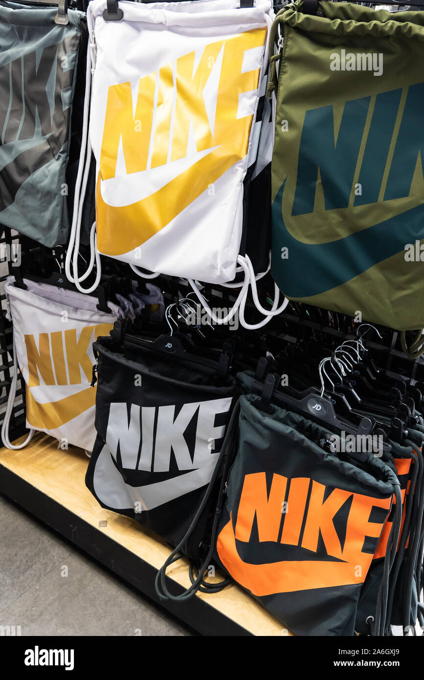 Nike bags on sale at the JD Sports store, shop in the city centre shopping  precinct, mall Stock Photo - Alamy