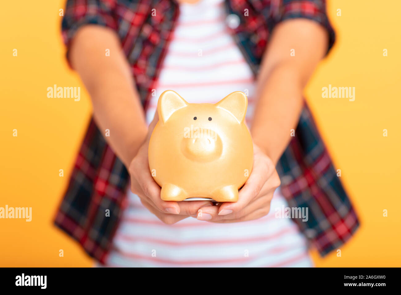 young asian woman showing piggy bank Stock Photo - Alamy