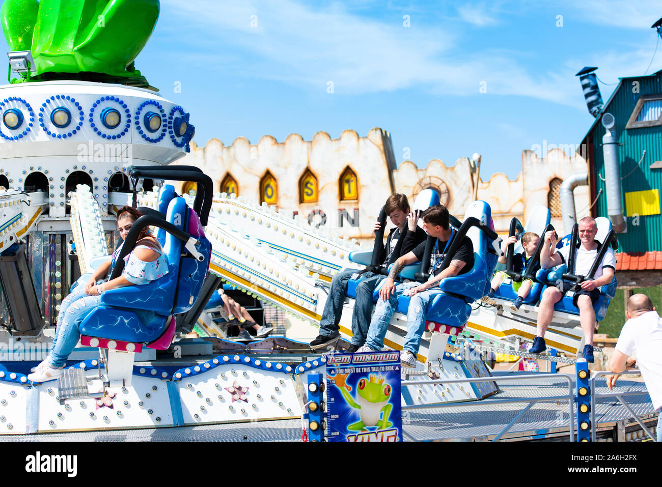 People enjoying rides at Southport please beach on a hot summers day Stock Photo