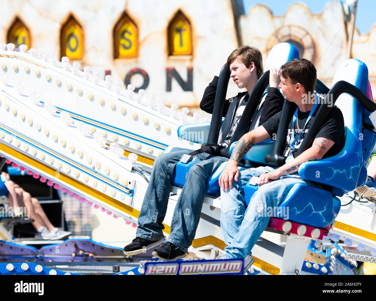 People enjoying rides at Southport please beach on a hot summers day Stock Photo