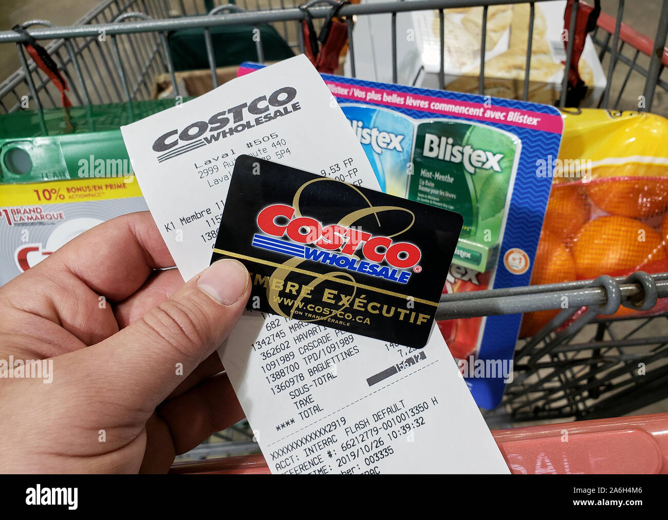 Montreal, Canada October 26, 2019 A hand holding a receipt and